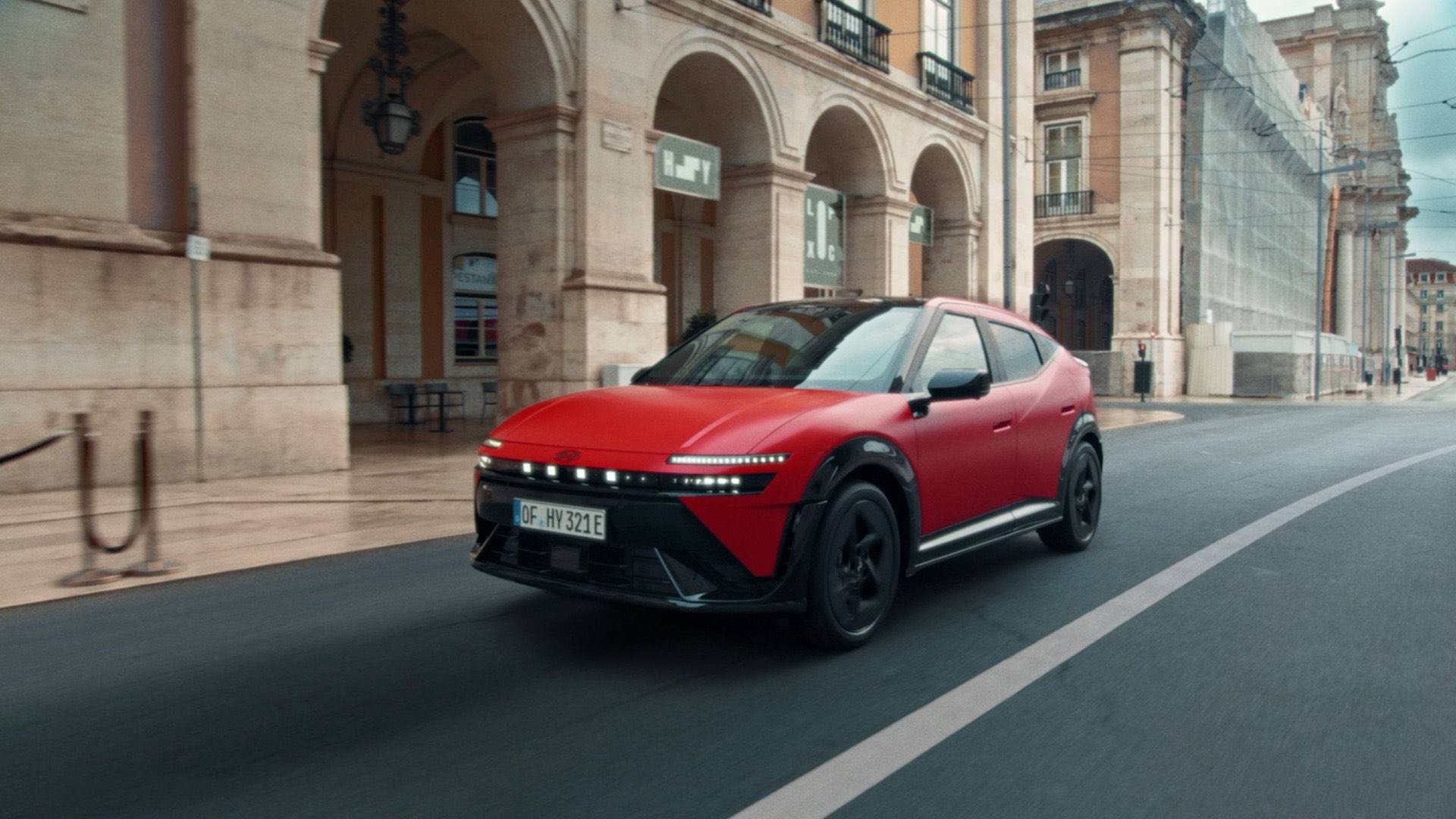 Driving video still of the Hyundai IONIQ 3 N Line in red.