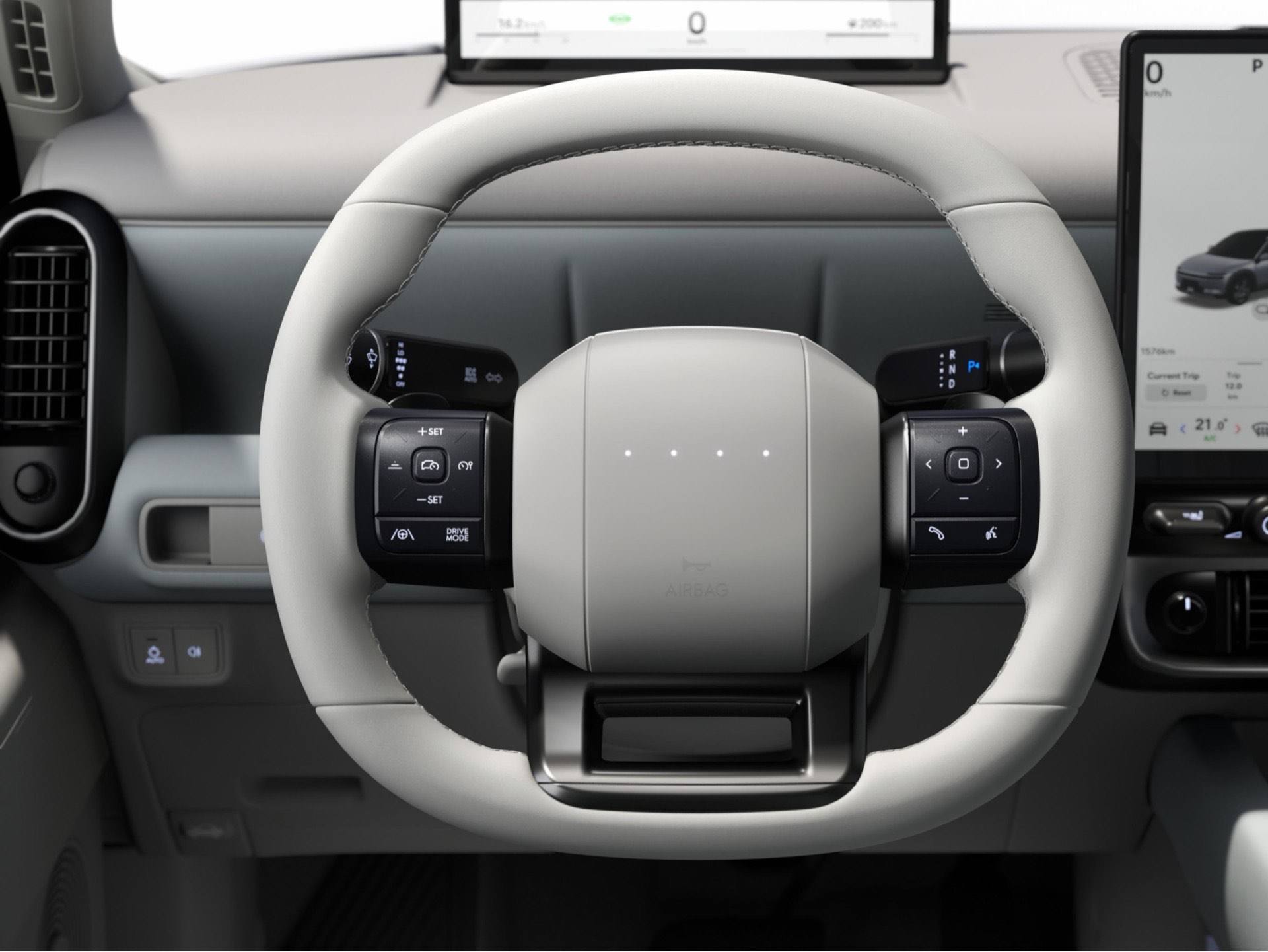 LED steering wheel and center touch screen inside the Hyundai IONIQ 3.