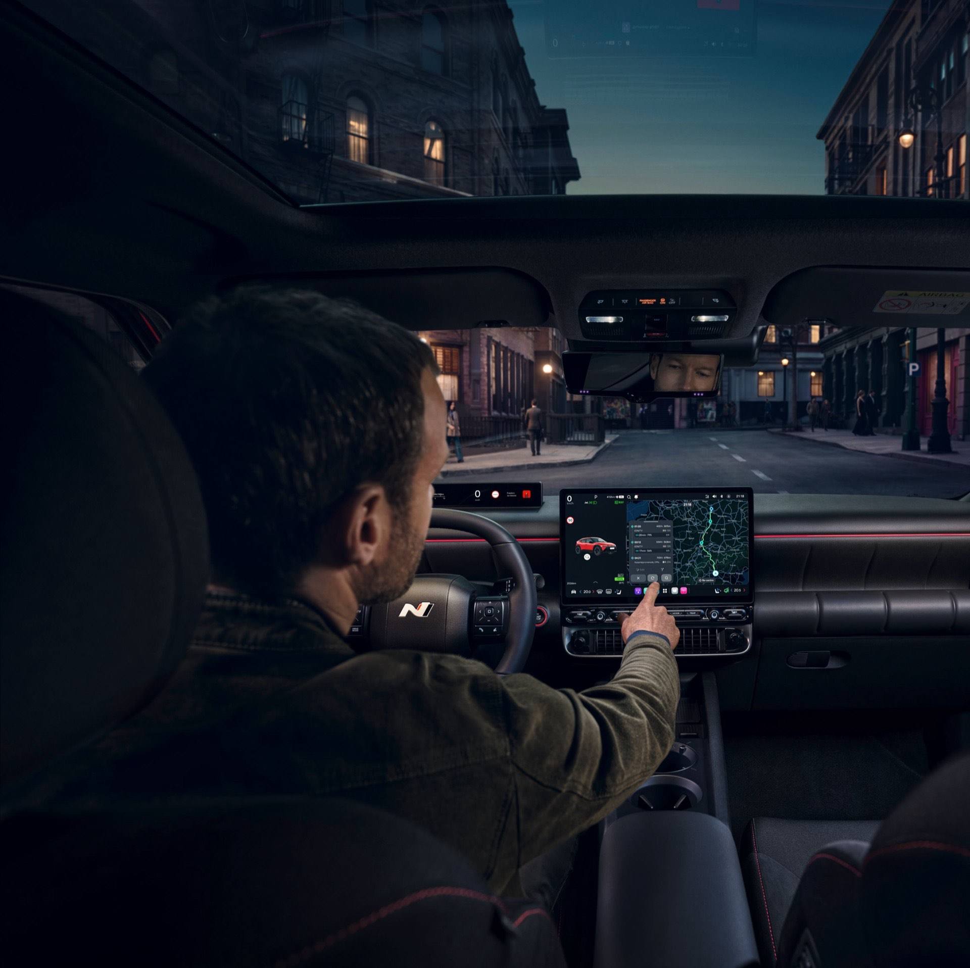 Man using the center touch screen inside the Hyundai IONIQ 3 N Line.