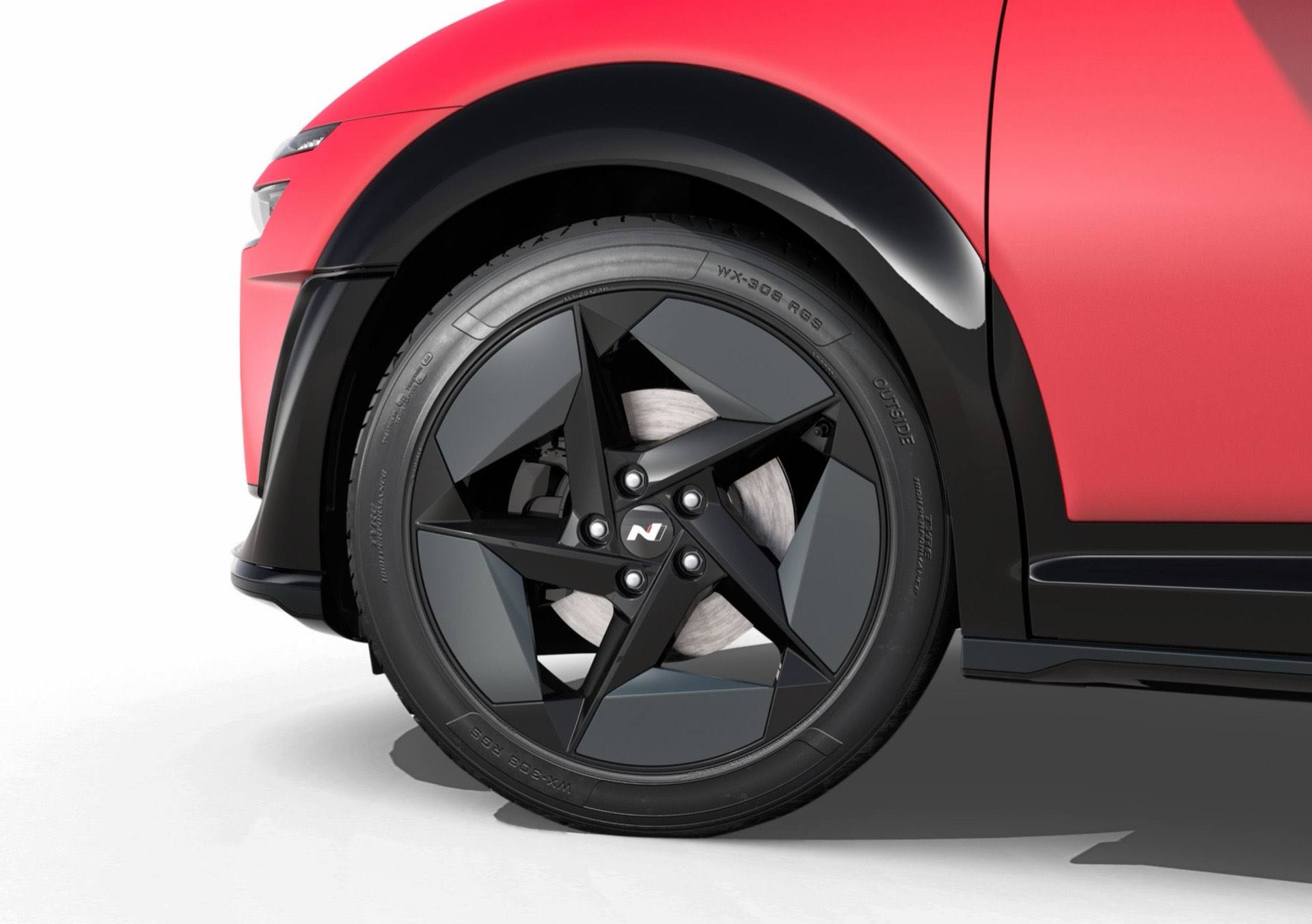 Close up view of the 19" N Line alloy wheel&nbsp;on a red Hyundai IONIQ 3 N Line.